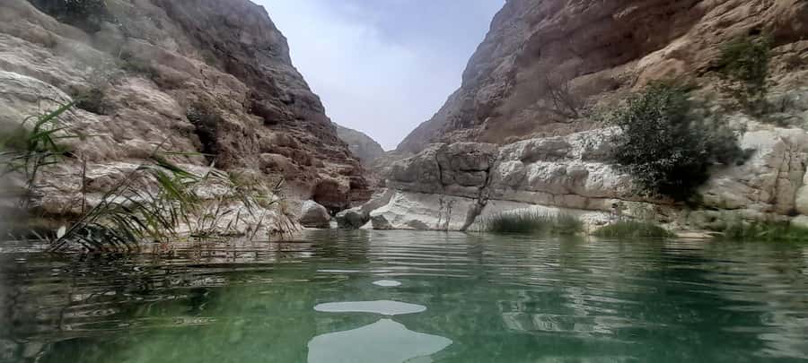 From Muscat: Guided Overnight Desert Camp Tour - Wadi Shab’s pools and hidden cave