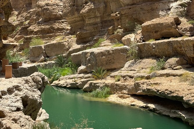 From Muscat Wadi Shab and Bimmah Sinkhole Tour - Walking through the canyon to the pools