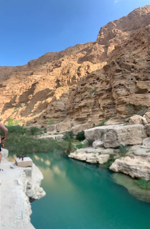 From Muscat: Wadi Shab & Sinkhole Private Tour & Free Lunch - Walking into Wadi Shab after the boat crossing