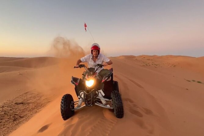 Full-Day Private Experience through Desert Adventure in Oman - Quad biking across the orange dunes