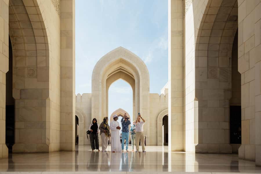 Guided Walking Tour of Sultan Qaboos Grand Mosque in Muscat - Crossing the entrance into a peaceful complex