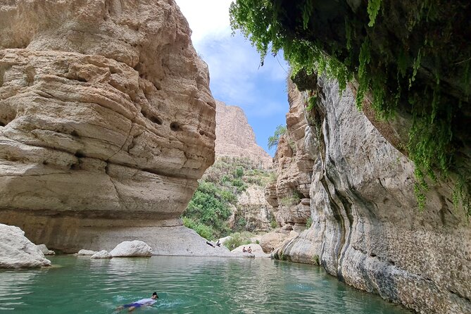Hidden Gems of Oman: Sinkhole, Fins Beach & Wadi Tiwi Adventure - Bimmah Sinkhole and its small lake