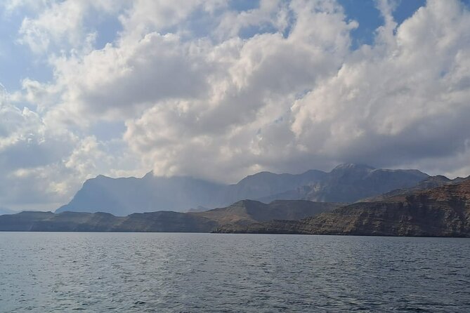 Khasab Musandam Half Day Dhow Cruise and Snorkeling Trip - Watching for dolphins beside the boat