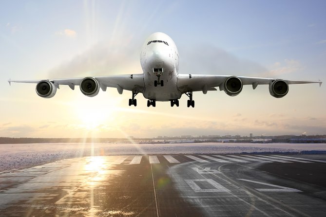 Muscat Private Arrival Airport Transfer - Walking out of Seeb Airport with a driver waiting