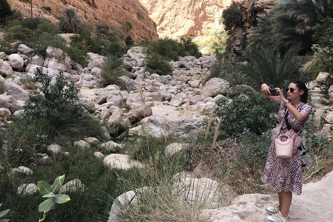 Private Day Trip to Wadi Shab & Bimmah Sinkhole Price Up To 5 Persons - Walking into Wadi Shab’s palm-lined canyon