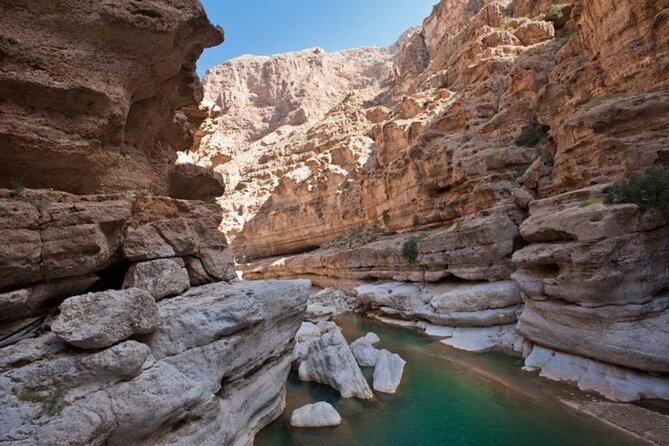 Private Full-Day Wadi Shab and Bimmah Sinkhole Tour - Swimming through the narrow keyhole